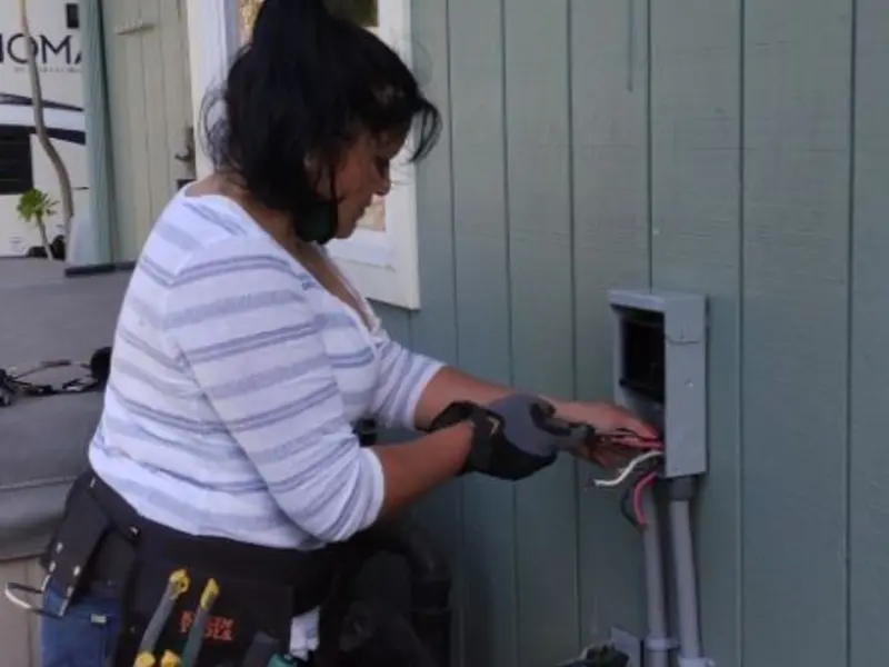 Licensed electrician wiring an exterior subpanel in Redmond